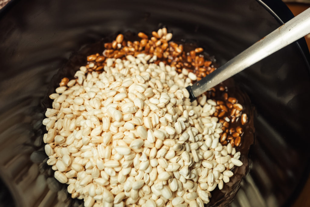 mixing ingredients for risboller with puffed rice and chocolate