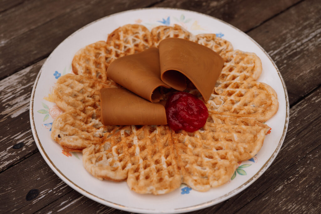 Norwegian waffles with strawberry jam and brown cheese