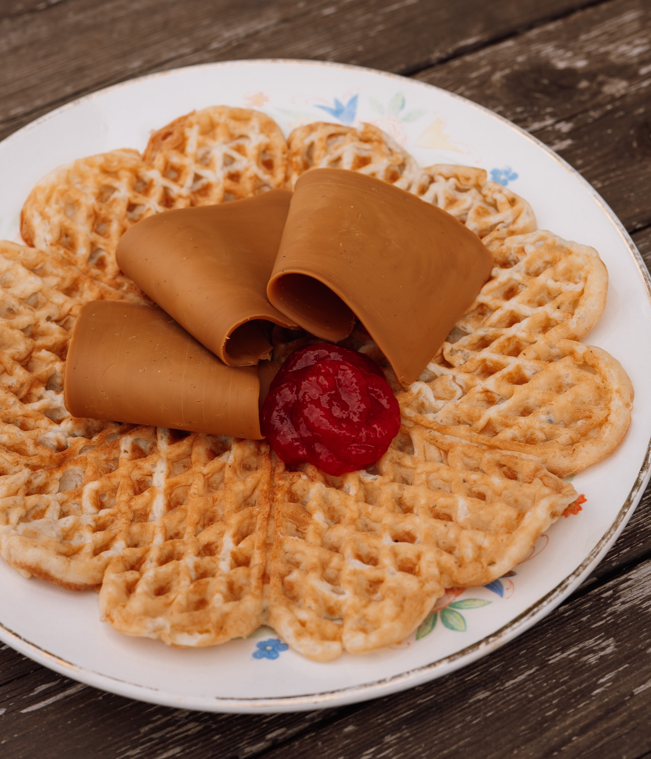 Norwegian waffles with strawberry jam and brown cheese