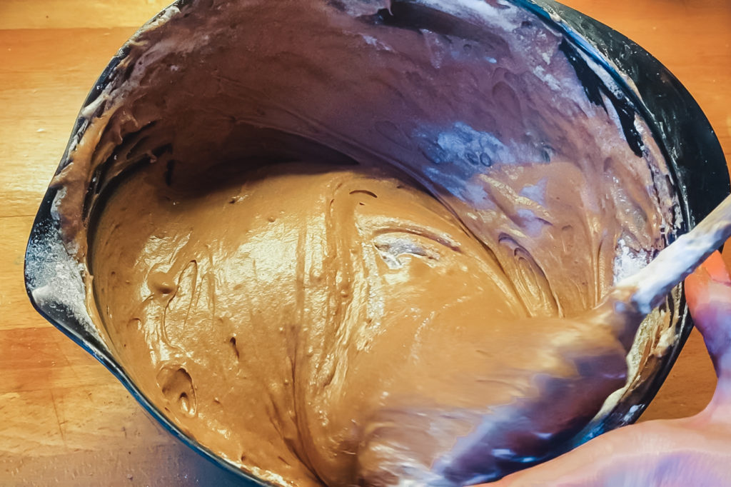folding flour into chocolate cake batter