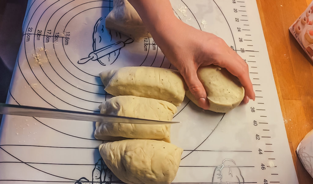 cutting the dough for fastevlavnsboller