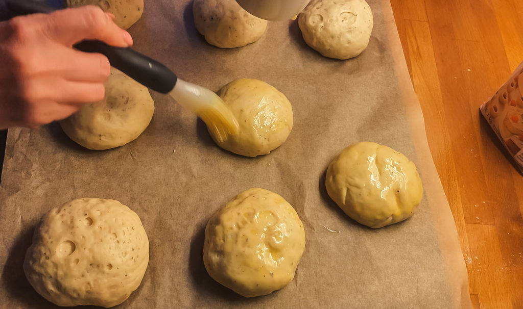 brushing fastelavnsboller dough with egg