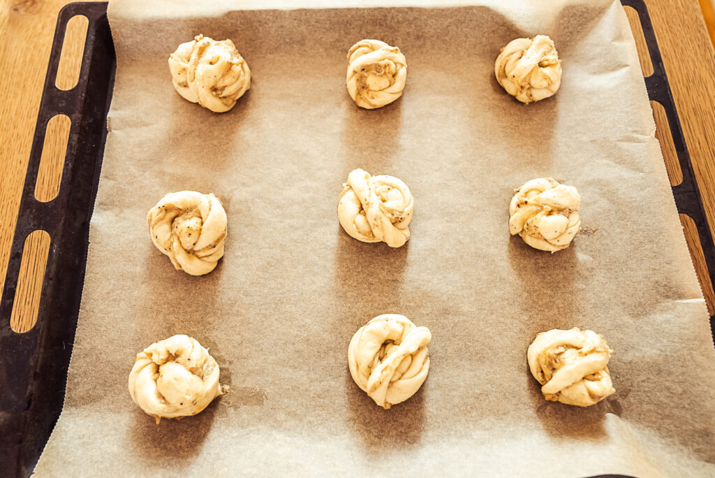 cardamom buns on baking sheet