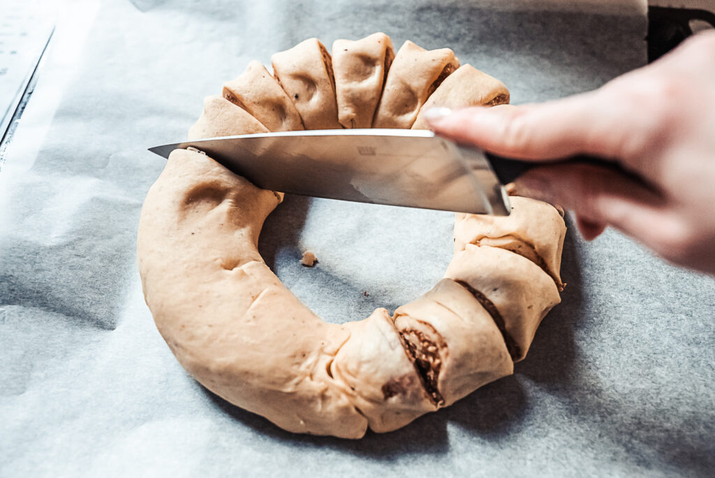 slicing kringle wreath dough