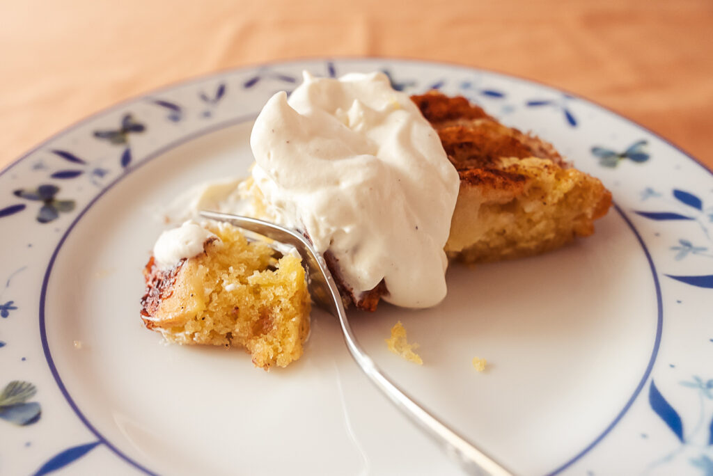 Norwegian apple cake with whipped cream on top
