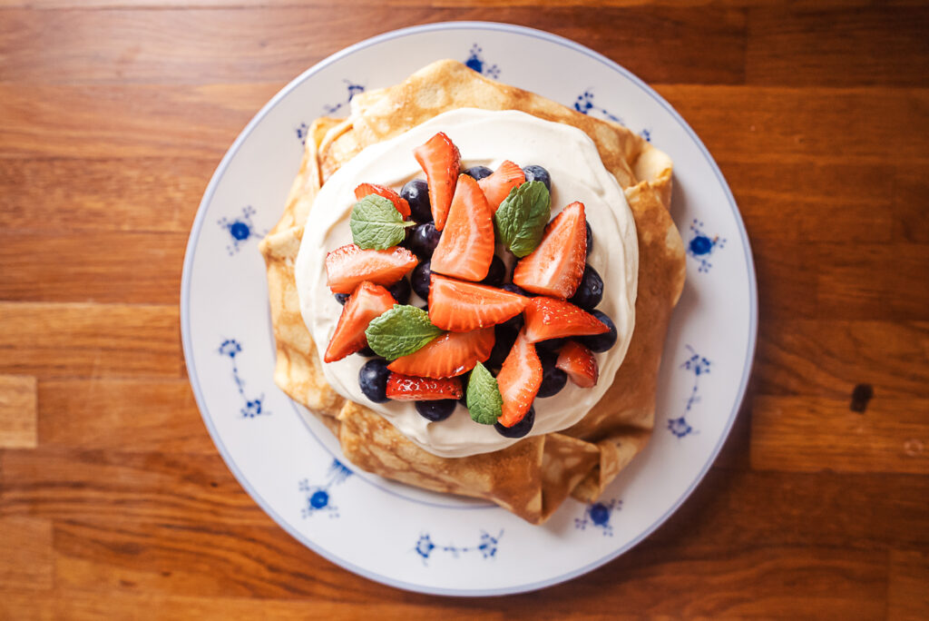 Pannkakstårta, Swedish pancake cake topped with cream and berries