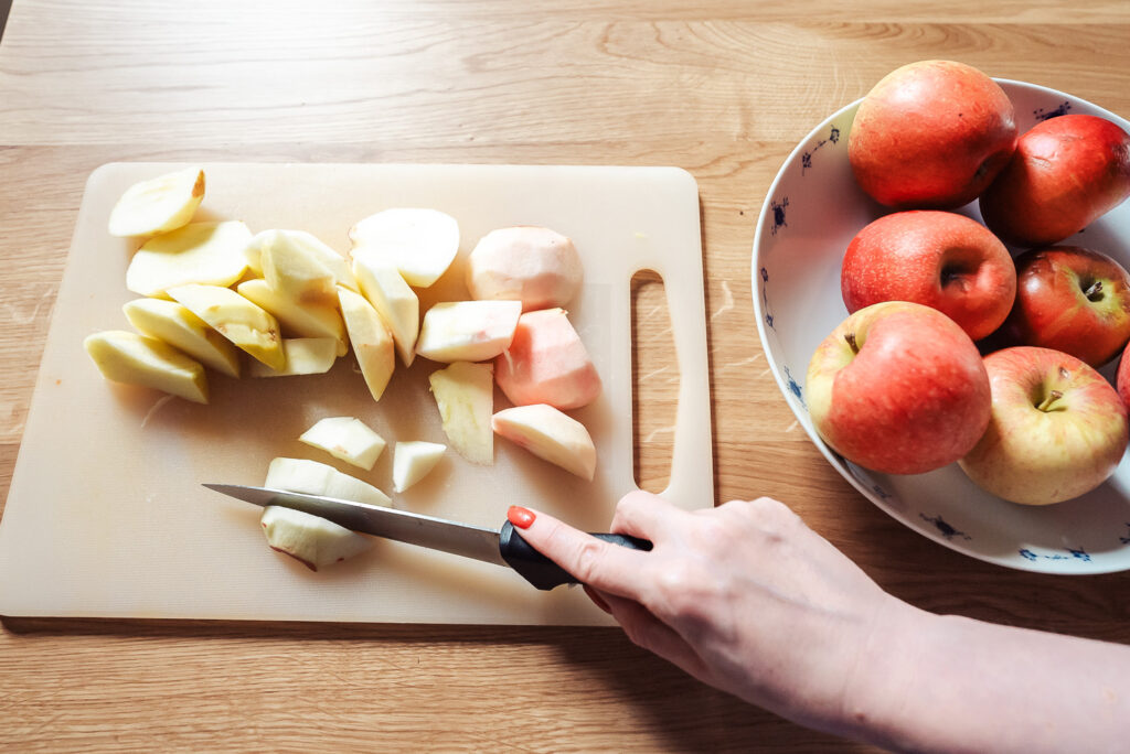 chopping apples on cutting board