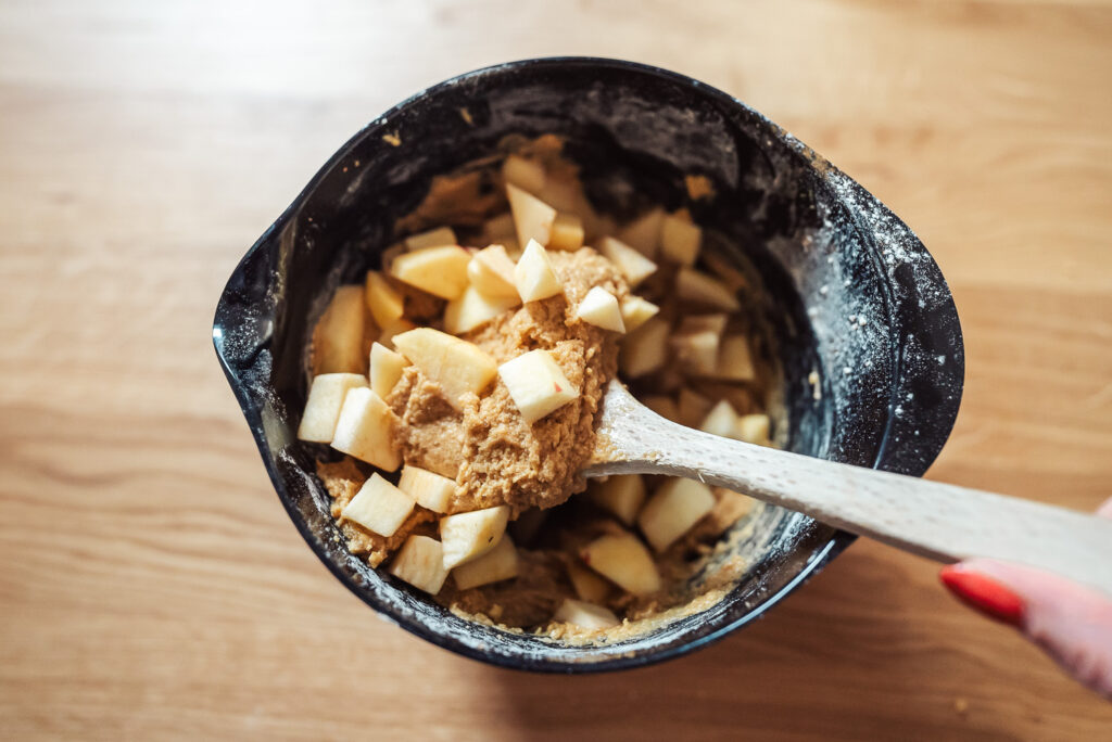 mixing Norwgian apple cinnamon cake batter