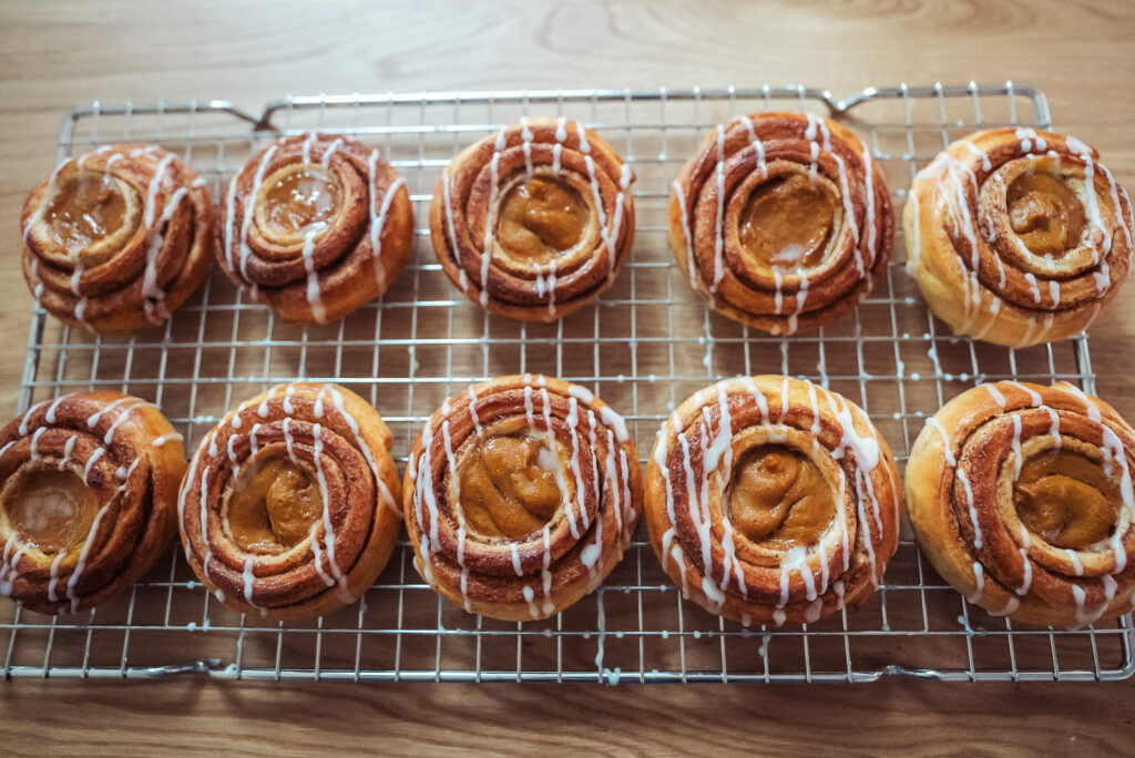 drizzle pumpkin cinnamon buns with icing