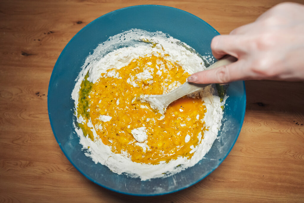 mixing saffron bun dough