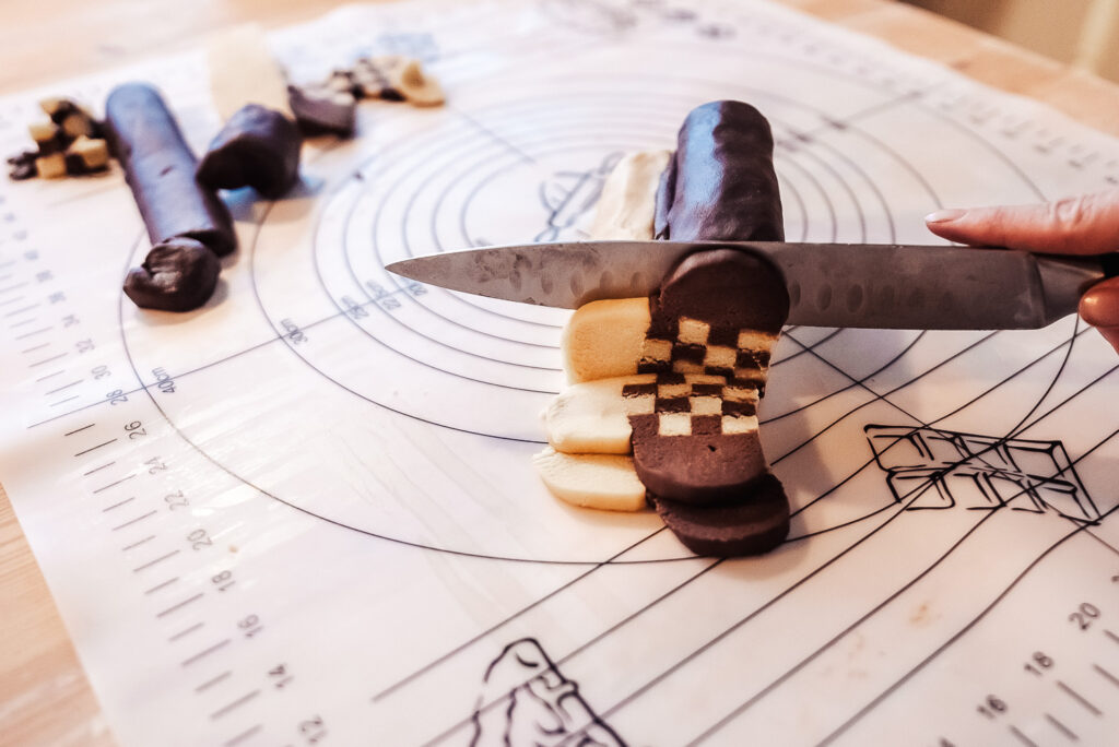 slicing heart shaped schackrutor cookies