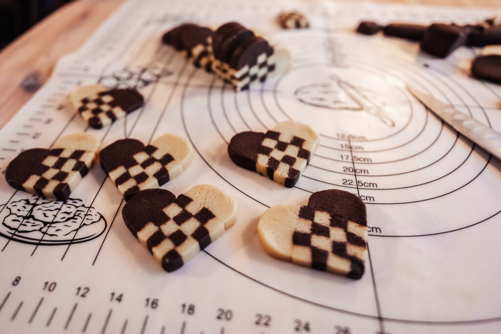 sliced heart shaped checkerboard cookies before baking
