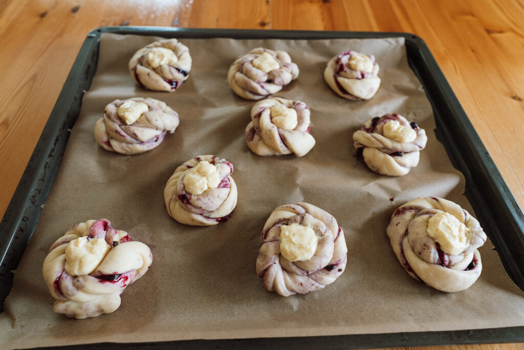 blueberry buns on baking sheet before baking